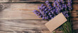 A stunning arrangement of vibrant purple lavender branches adorns a rustic wooden table, accentuated by a blank label awaiting customization.