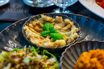 Wall Mural - Vegetarian dishes, mezze in Turkish restaurant, bulgur pilaf, grilles eggplants and fresh vegetables salad