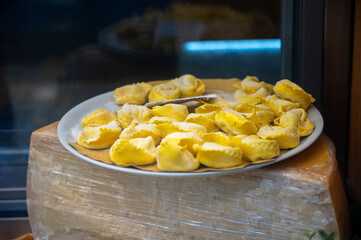 Wall Mural - Italian food, fresh homemade stuffed pasta tortelli or ravioli dumplings ready to cook, Milan, Lombardy, Italy