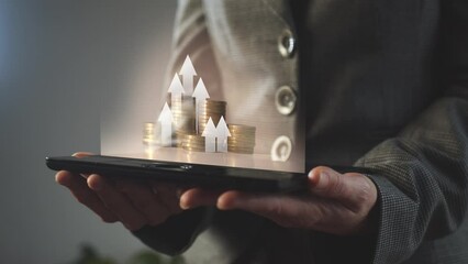 Poster - Arrows moving upward against the background of growing columns of coins above an electronic tablet in the hands of a businesswoman.