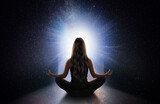 Fototapeta Las - woman meditating front the universe