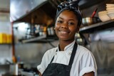 Fototapeta Do akwarium - Portrait of a young female chef in commercial kitchen