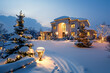 A grand luxury residence captures the essence of winter with a snow-covered front yard illuminated by festive lights.