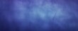 Indigo grainy background with thin barely noticeable abstract blurred color gradient noise texture banner pattern with copy space