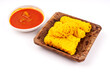 Close up of Roti Jala or Net Bread and curry sauce on white background