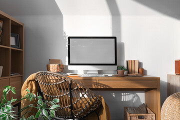 Sticker - Modern workplace with computer, books and chair in light office