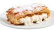 Delicate pastry topped with sweet icing resting on a pristine white plate