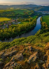 Wall Mural - Fresh spring landscape after sunset with a beautiful colorful sky and a river under a rocky cliff. Hron River, Hronsky Benadik, Slovakia