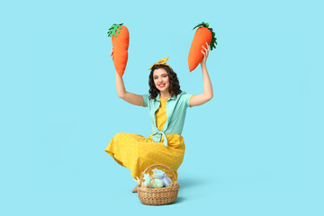 Sticker - Happy pin-up woman with toy carrots and Easter basket on color background