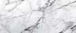 A closeup image of a snowy white marble texture resembling a frozen slope. The intricate pattern mimics the natural beauty of a winter landscape