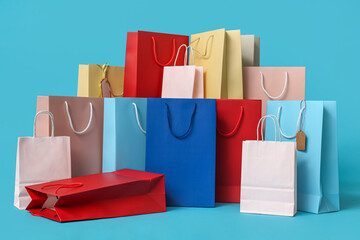 Many shopping bags on blue background