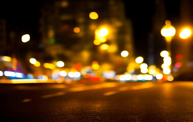 Wall Mural - Background of night street with bokeh blurred light car and street lamps. Abstract backdrop of defocused lights at cityscape, city life. Concept of stylish urban backgrounds for design. Copy space