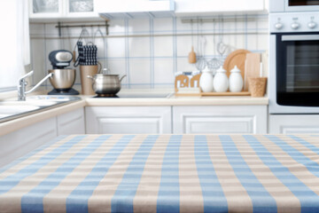 Aufkleber - Kitchen interior with a blue and white checkered tablecloth over a table, blurred background. High quality photo
