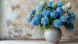 © Виктория Дутко - Blue and white hydrangea flowers in vase on wooden table.