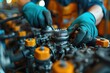 Mechanic in blue gloves repairs the engine of a heavy vehicle,closeup