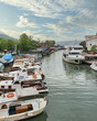 Goksu Stream, with docked group of different shapes, sizes and colors boats, located beside Anadolu Hisari historic castle on the Anatolian side of the Bosporus in Beykoz district, Istanbul, Turkey