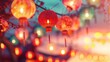 Illuminated traditional red lanterns hanging from cherry blossoms against soft-focus background, evoking festive spirit. Chinese New Year celebration and decoration.