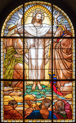 Wall Mural - MILAN, ITALY - MARCH 6, 2024: The Transfiguration in the stained glass of the church Chiesa del Redentore by author with the initials G.R. (1933).