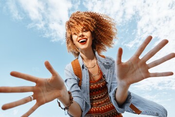 Wall Mural - Happy Traveler: Beach Joy, Smiling Woman with Backpack, Embracing Freedom and Happiness