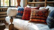 © lin - Ethnic Patterned Pillows on a Daybed with Wooden Sculpture
