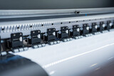 Fototapeta Kosmos - Close-up of large format printer heads in action