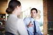 © peopleimages.com - Business people, talking or meeting in office for corporate project or collaboration on work. Professional woman, man and discussion of company finance for feedback and teamwork in accounting firm