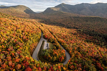 Aerial view hairpin turn on mountain road in the fall in New Hampshire