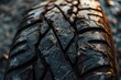 Close-up of a wet tire tread highlighting its texture.