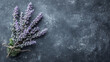 A bunch of purple lavender flowers are on a black background. The flowers are frozen and appear to be delicate and fragile. The black background creates a sense of contrast