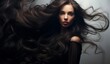 © Surachetsh - a woman with luscious, glossy, wavy black hair, radiating health and vitality with every sleek strand.