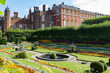 Georgian and Tudor facades and sunken gardens of Hampton Court Palace in East Molesey