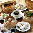 A Chinese dim sum breakfast, featuring a selection of steamed buns, dumplings, and rice noodle rolls, perfect for sharing. 