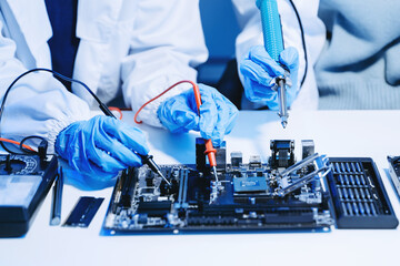 Wall Mural - The technician is putting the CPU on the socket of the computer motherboard. electronic engineering electronic repair, electronics measuring.