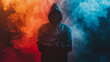 A man in a hoodie stands in front of a colorful background with smoke. Concept of mystery and intrigue, as the man's face is partially obscured by the smoke and the background is a mix of red