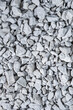 Construction Materials Ideas. Closeup Image of Background Made of Pile of Colorful Grey Crushed Stone.