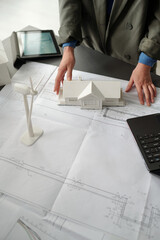 Aufkleber - Hands of young unre4cognizable businesswoman in grey blazer standing by desk with blueprint and working over new project in office