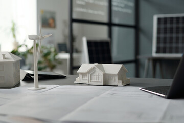 Aufkleber - Workplace of modern architect with unrolled blueprint surrounded by laptop, models of houses and windmill and digital tablet