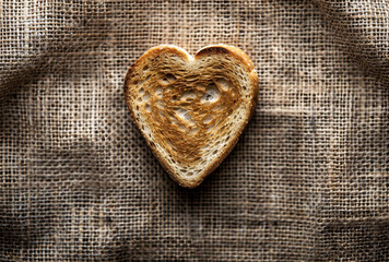 Wall Mural - Heart shaped toast on burlap