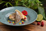 Fototapeta Sypialnia - Grilled sea bass fillet with raspberries sauce and white polenta Fusion food