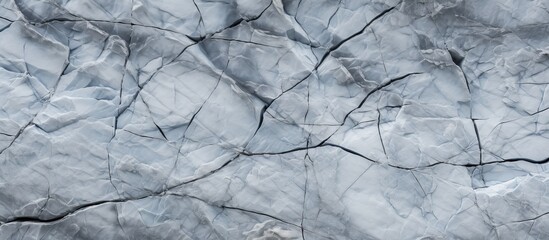 Sticker - A close up of a cracked piece of ice with a pattern resembling a twig or plant, frozen in time during a winter event in a natural landscape