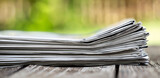 Fototapeta Zwierzęta - Stack of newspapers. Daily news, journalism banner or background with copy space.