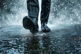 Fototapeta Sawanna - wet shoes of a businessman as he walks in a storm