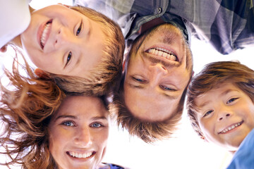 Canvas Print - Face, portrait and family smile outdoor with happiness in countryside of New York for holiday. Children, mother and father together with love in hometown for break to bonding, low angle or excitement