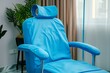 chair with blue protective covers and headrest