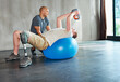 © peopleimages.com - Physiotherapy, disability and patient with kettlebell or exercise ball at gym for recovery, strength and healthcare rehabilitation. Physiotherapist, wellness and support or consultation for amputee