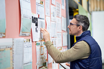 Poster - Warehouse, man and board in business for planning or operations, shipping or logistics or management. Male person, clipboard and schedule in workplace for review or job, inventory or supply and check