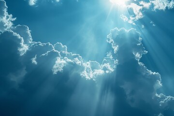 Poster - A clear sky dotted with fluffy white clouds. The sunlight filters through the clouds, casting a warm glow over the landscape. The scene radiates tranquility and serenity.