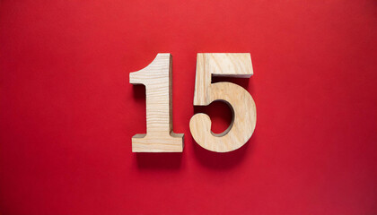 Fototapete - 3D number 15 made of wood. Flat lay on red background with copy space.
