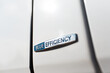 Blue efficiency icon on white car body.