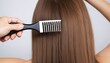 Hairs fall in comb. brushing with loose hair, from health problems. concept of hair loss